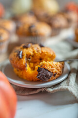 Homemade pumpkin muffins or cupcakes with chocolate 