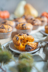 Homemade pumpkin muffins or cupcakes with chocolate 