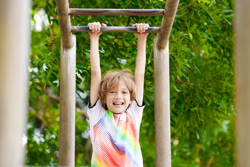 Child on playground. Active kid in school yard.