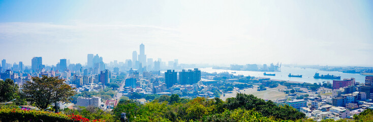 Naklejka premium Kaohsiung, Taiwan, Republic of China, 01 25 2024: The landscape of Kaosiung port harbor, downtown, taiwan strait, and shoushan mountain 