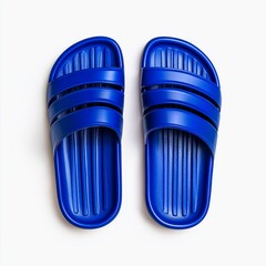 "Bright blue rubber slides on a white background, perfect for summer and casual wear. Comfort, leisure lifestyle concept."


