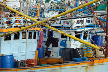 masts of old Thai fishing boats close up