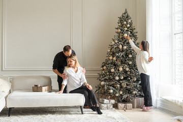 Family celebrating Christmas, exchanging presents 