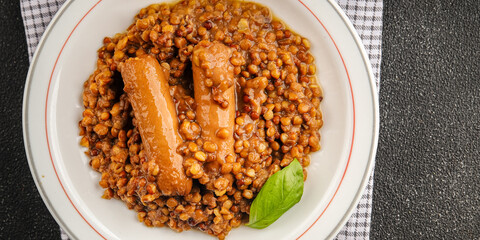 Lentil with sausages tasty food dish second course аresh delicious gourmet food background on the...