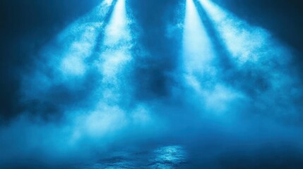Fototapeta premium Two spotlights illuminate a stage filled with atmospheric fog, creating a dramatic and moody scene.