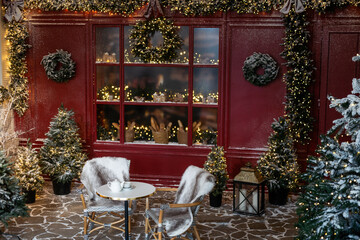Brightly illuminated christmas decorations cafe. Outside decor for winter holidays