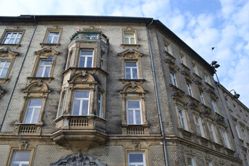 Beautiful Krakow market square. Faded colors. Vintage elegant carriages with beautifully dressed horses ride people around the historic center of Krakow on the old streets of Europe High quality photo