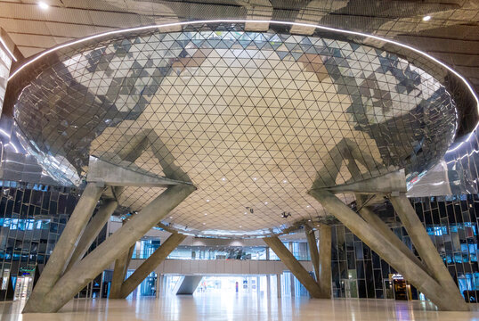 Moscow, Russia - August 29, 2024: A futuristic interior view of the Skolkovo Technopark in Moscow, featuring the modern geodesic dome structure supported by concrete pillars.