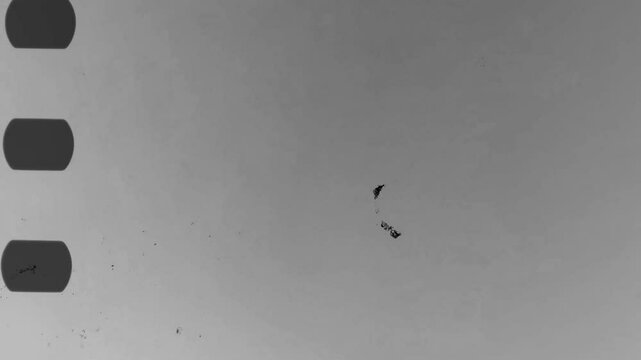 Vintage looping film strip white background. Videotape with scratches and stains. Old camera roll animation. Dirt, grain and scratches to add an analog touch. High quality 4k footage