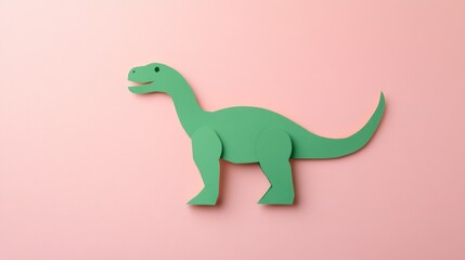 Fototapeta premium Minimalist green dinosaur paper cut on light pink background ideal for kids’ educational posters or toys