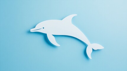 Fototapeta premium Dolphin swimming in ocean paper cut on blue background fun marine-themed design great for children’s books or posters