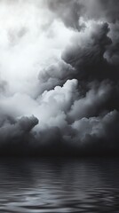 Fototapeta premium Dramatic dark clouds reflecting over calm water, creating a serene yet intense atmosphere. Perfect for mood and nature themes.