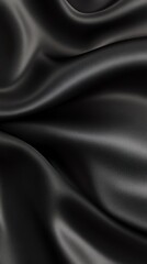 Obraz premium Elegant black satin fabric with smooth, flowing texture, perfect for fashion, design, and artistic backgrounds.