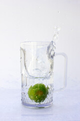 Lime Splashed Water motion photography in the studio.
