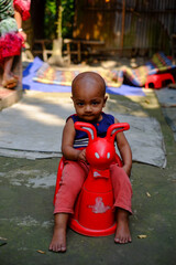 South asian little boy playing with a toy