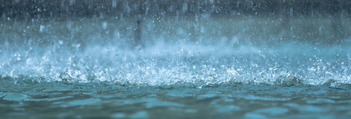 Heavy raindrops splashing on the ground