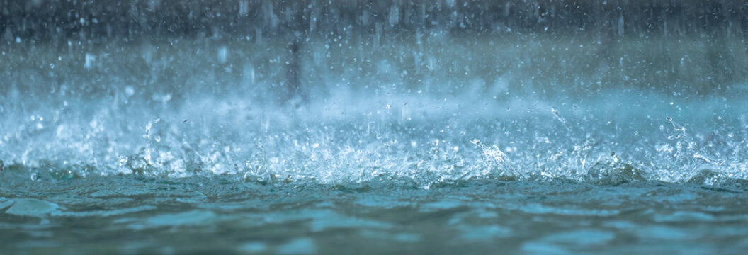 Heavy raindrops splashing on the ground