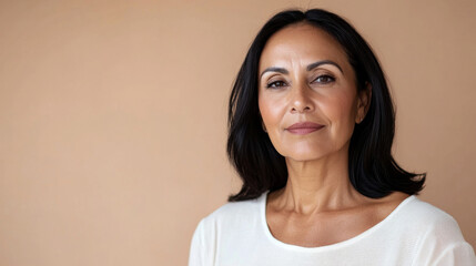 Portrait of middle-aged woman with long hair and white blouse