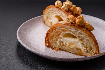 Sweet crispy croissant with salted caramel and glazed popcorn
