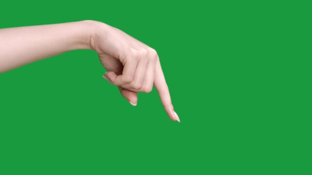 Vertical video. Hand pointing. Look here. Special offer. Woman index finger showing aside isolated on green chroma key empty space advertising background.