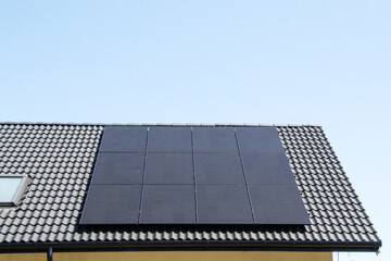 Fototapeta premium Solar power energy on the roof to a standard house