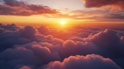 Beautiful bright dramatic sunset sky with fluffy clouds a view from above. Sky background.