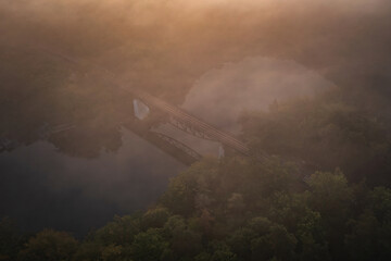Foggy scenery and the railway bridge in Rutki, Kashubia. Poland