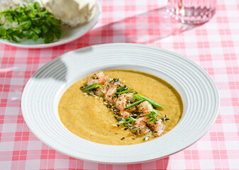 pumpkin soup with shrimp and pumpkin seeds