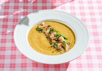 pumpkin soup with shrimp and pumpkin seeds