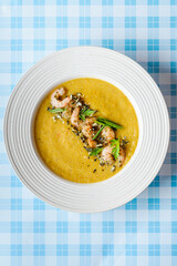 pumpkin soup with shrimp and pumpkin seeds