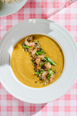 pumpkin soup with shrimp and pumpkin seeds