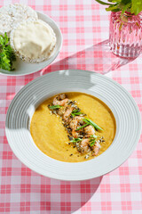 pumpkin soup with shrimp and pumpkin seeds