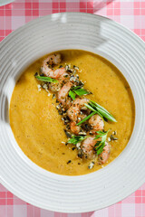 pumpkin soup with shrimp and pumpkin seeds