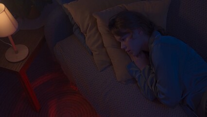 Woman in pajama sleeping in bed in dark apartment room, monster hiding under bed. Girl waking up hearing storm and lightning. Halloween horror concept. © kinomaster