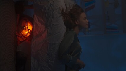 Woman sitting on the bed in dark apartment room, falls on the bed, creepy monster with lighted face...