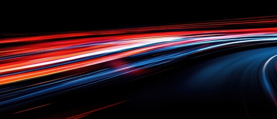 Abstract light trails in motion, conveying speed and energy against a dark background.