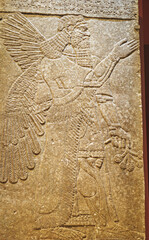 Winged Figure. Architectural Fragment Of Panel From Northwest Palace Of Ashurnasirpal Ii By Neo Assyrian Period. Depicted Is Winged Human Divine Spirit, Protective Spirit. Chosen Viceroy And High