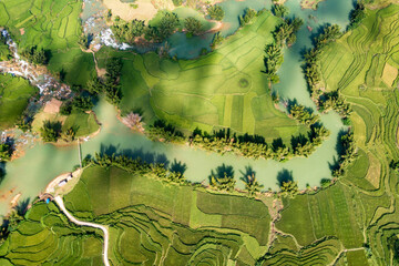 Aerial landscape in Quay Son river, Trung Khanh, Cao Bang, Vietnam with nature, green rice fields and rustic indigenous houses.