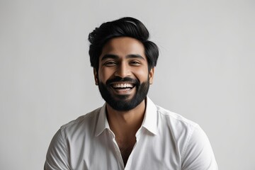 Obraz premium Stunning Portrait of Happy Indian Man with Beard on Bright White Background