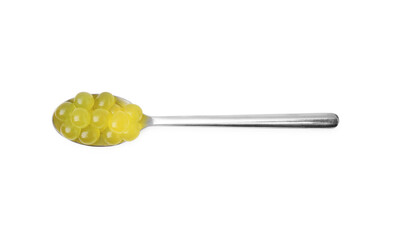 Bright tapioca pearls in spoon isolated on white, top view