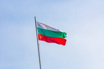 Bulgarian national flag waving in a blue sky