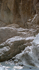 Stream in deepest narrow stone canyon Saklikent in national park in Mugla Province in southwestern Turkey. Vertical image