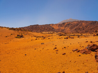 spot in Tenerife with many red rocks and beautiful mountain landscape background
