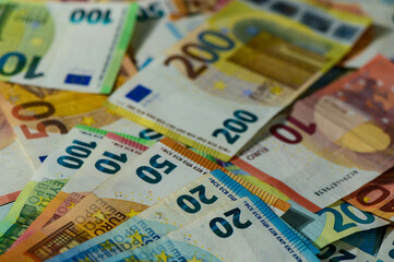 Lots of euro notes on table