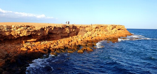 
Panorama of the Mediterranean Sea in Spain with a view of the rocks, lighthouse, tourists walking on the observation deck. Sea coast, sea cliffs, excursion Mediterranean Sea, relaxation, beach.