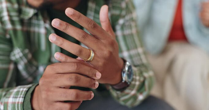 Man, ring hand and stress for divorce with relationship conflict, infidelity and angry woman in home. Husband, wedding jewelry and doubt for marriage crisis with cheating drama, sad and toxic partner