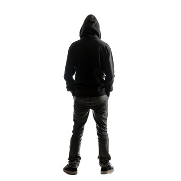 Young man wearing a hoodie is standing with his back turned and his hands in his pockets
