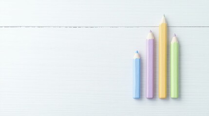 Obraz premium Dual Perspective: A Close-Up of Two Pencils on a Clean Surface, Showcasing Their Unique Designs and Textures in a Minimalist Setting
