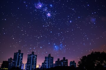 Naklejka premium A city skyline is lit up at night with a clear sky full of stars, generative ai image