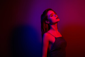 Photo of charming gorgeous dreamy hot girl enjoying club party isolated on neon dark color background